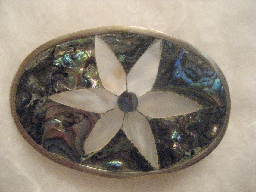 Gorgeous Ladies Sterling Flower Buckle: Beautiful mother of pearl flower surrounded by abalone. It is 2” long and 1.5” wide. Will hold a 1.25” belt.