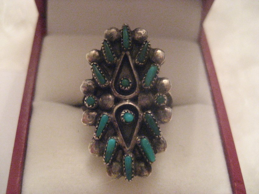 Navajo Sterling Needlepoint Ring: 13 pieces of turquoise. Size 5.5. Weighs 4.5 grams. Beautiful turquoise points.