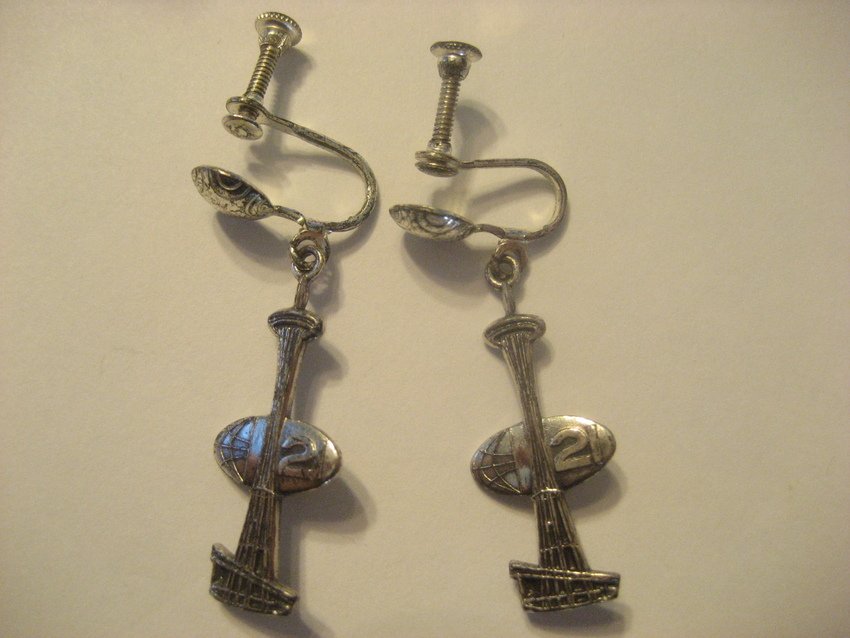 World's Fair Seattle Space Needle Earrings: From the World's Fair in 1962 in Seattle where the Space Needle was opened, these dangling earrings are 1 and 1/8” long and are 1/2” wide, perfect for you World's Fair souvenir collectors.