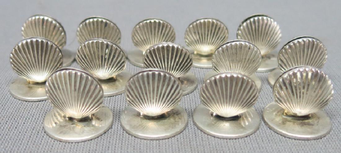 TIFFANY & CO. STERLING SILVER PLACECARD HOLDERS: FOURTEEN TOTAL IN SCALLOP SHELL DESIGN; 1" TALL; 4.25 OZT.