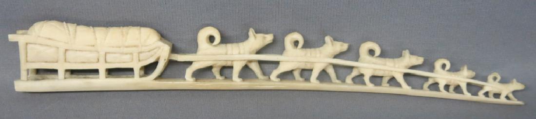 INUIT CARVED WALRUS TUSK OF A SLED DOG TEAM