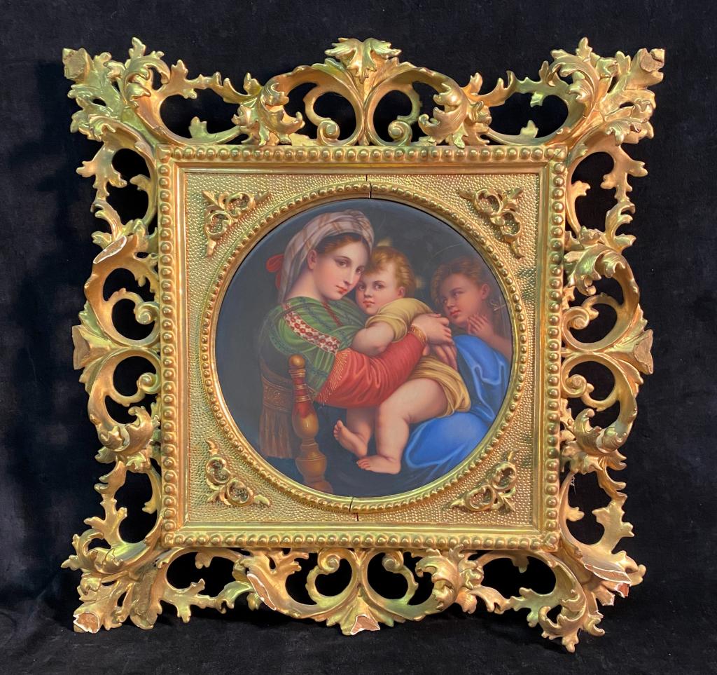 ORNATELY FRAMED GERMAN PORCELAIN PLAQUE OF MADONNA: DEPICTION OF 'MADONNA DELLA SEDIA' AFTER RAPHAEL, ORNATE GILT ITALIANATE FRAME HAS SOME LOSS; PLAQUE IS 9 3/4" ROUND, FRAME IS APPROX. 18" SQUARE