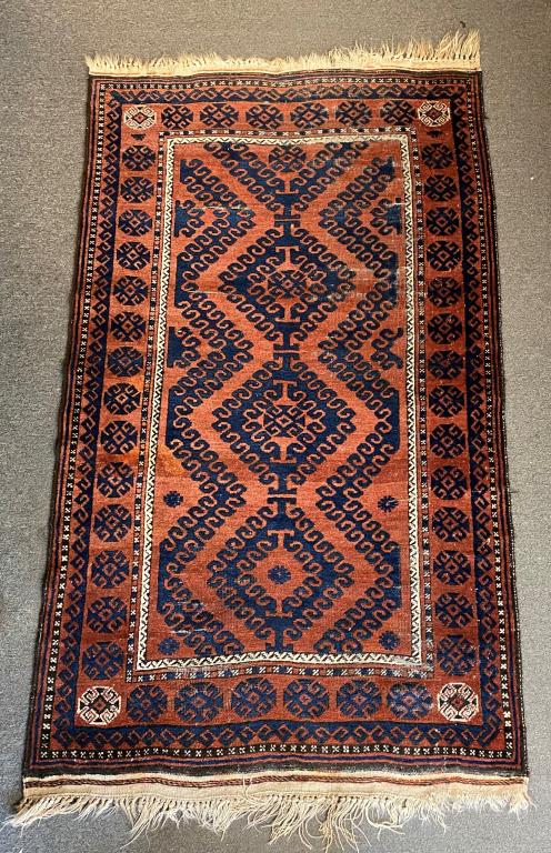 AFGHANI BELOUCH AREA RUG: EARLY TO MID-20TH C; APPROXIMATELY 6'6" X 3'10"; SOME WEAR AND OXIDATION OF THE BLACK DYE AS SEEN IN PHOTOS, BUT SELVEDGES AND FLAT WEAVE ENDS ARE ALMOST ALL INTACT
