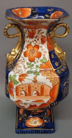 19TH C. GAUDY DECORATED IRONSTONE VASE: 19TH C. GAUDY DECORATED IRONSTONE VASE WITH GILT SERPENT HANDLES; IMPRESSED MARK; 9" TALL