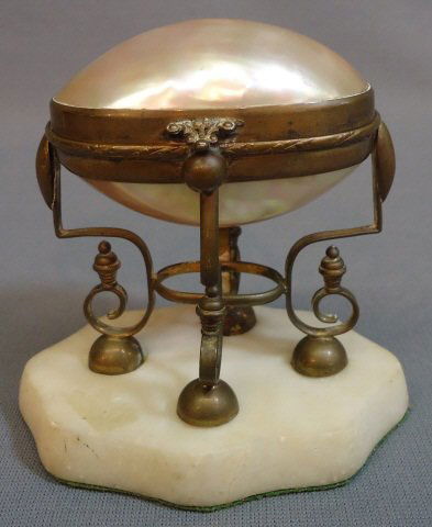 MOTHER OF PEARL EGG TRINKET BOX: MOTHER OF PEARL EGG TRINKET BOX SET IN A DECORATIVE BRASS STAND ON MARBLE BASE; 4 1/4" TALL