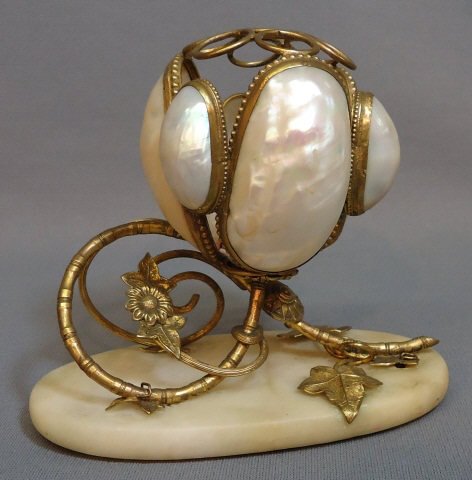 MOTHER OF PEARL AND ORMOLU PEN STAND: MOTHER OF PEARL AND ORMOLU PEN STAND ON AN OVAL MARBLE BASE; 5" TALL