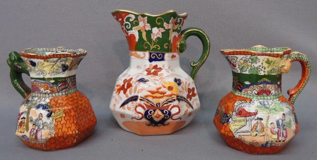THREE MASON'S IRONSTONE CREAM JUGS: THREE MASON'S IRONSTONE CREAM JUGS 'RED SCALE' AND 'VASE WITH FLOWERS' PATTERNS; 4" AND 6"