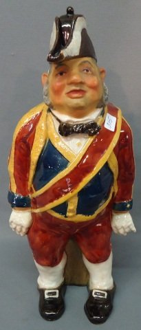 PORTUGUESE MAJOLICA GLAZE EARTHENWARE BOTTLE: PORTUGUESE MAJOLICA GLAZE EARTHENWARE BOTTLE FIGURAL OF A CHARACTER SOLDIER; 15" TALL