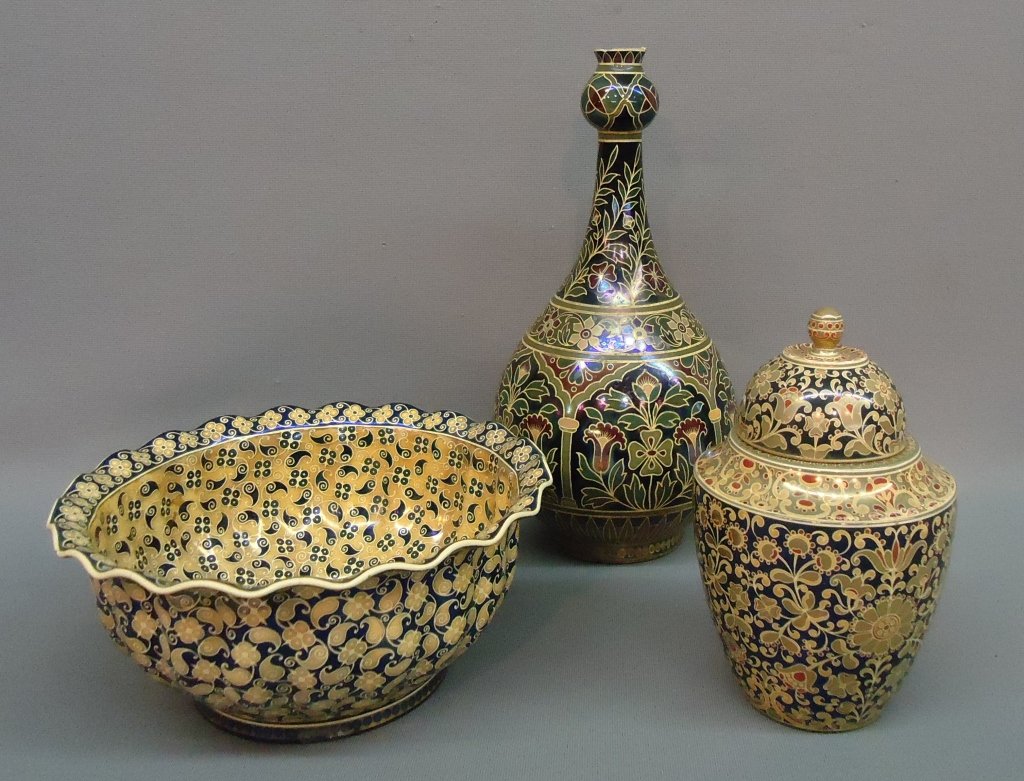 THREE ZSOLNAY PECS POTTERY PIECES: IRIDESCENT PAISLEY BOWL, BOTTLENECK VASE AND COVERED JAR; ALL HAVE MINOR DAMAGE; VASE IS 10 1/2" TALL, BOWL IS 7 3/4" WIDE, JAR IS 6 1/2" TALL INCL. LID/FINIAL