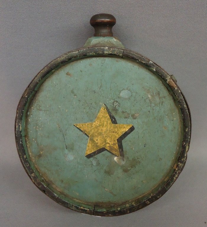 EARLY 19TH C. PAINTED WOOD CANTEEN: IN BLUE/GRAY PAINT WITH GOLD 5 POINT STAR; ORIGINAL STOPPER & CARVED INITIALS L.W.; 7" DIAMETER