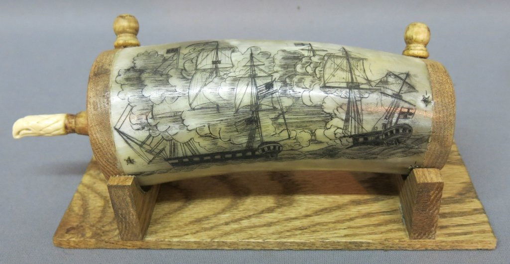 SCRIMSHAW POWDERHORN BY J.R. LAUBIN: UNSIGNED; WITH CARVED BONE EAGLE'S HEAD STOPPER; 9" TOTAL LENGTH