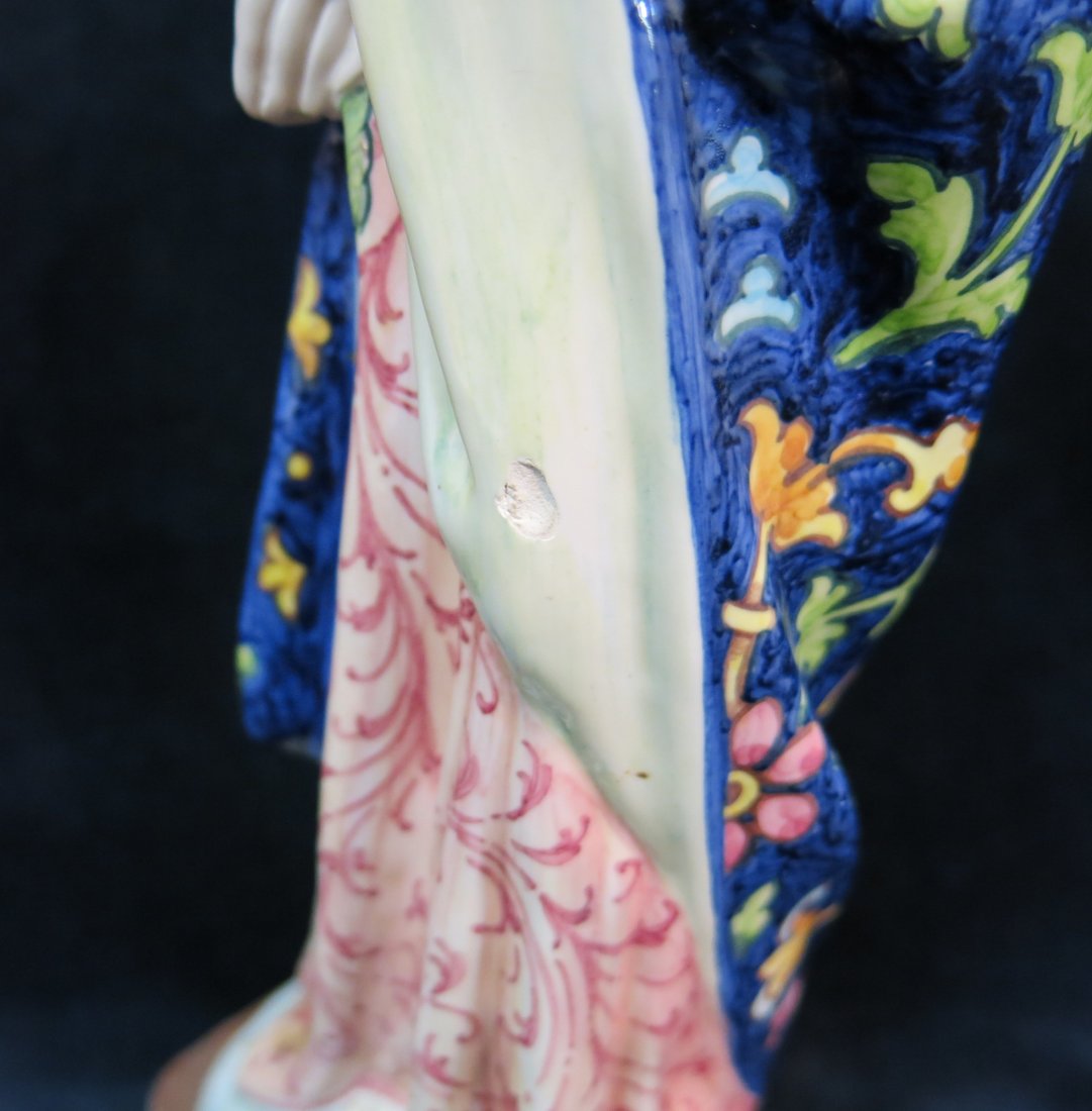 TWO ITALIAN FAIENCE RELIGIOUS STATUETTES: ONE IS 14 1/2" TALL BY ANGELO MINGHETTI HAS A SMALL CHIP, THE OTHER IS 7" TALL