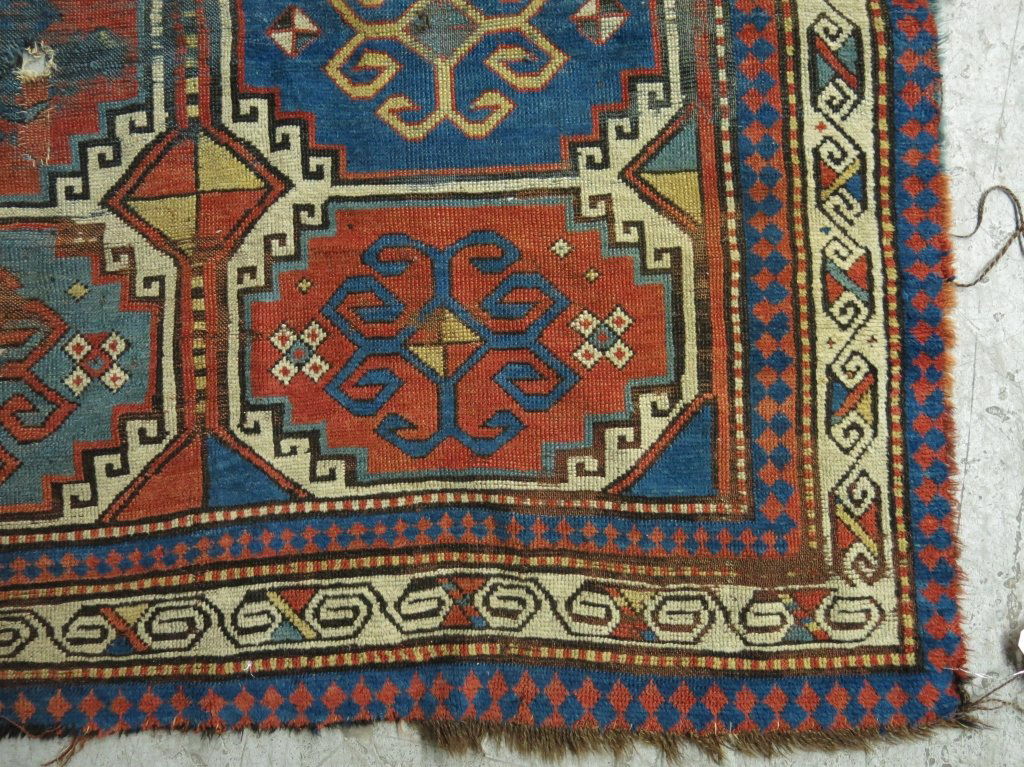 ANTIQUE TURKISH AREA RUG: WITH WEAR, HOLES, REPAIR; 4' 9" X 6'