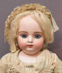 FRANCOIS GAULTIER BEBE F9G: BLOCK LETTER MARK; BISQUE SWIVEL HEAD ON SHOULDER PLATE; BLUE PAPERWEIGHT EYES, CLOSED MOUTH, PIERCED EARS, MOHAIR WIG; GUSSETED KID BODY 21" TALL; LACE DRESS & UNDERGARMENTS, LEATHER PURSE &