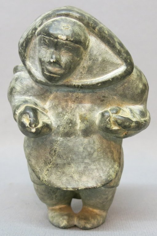 INUIT CARVED STONE FIGURE OF A SEAL HUNTER: 6 1/2" TALL