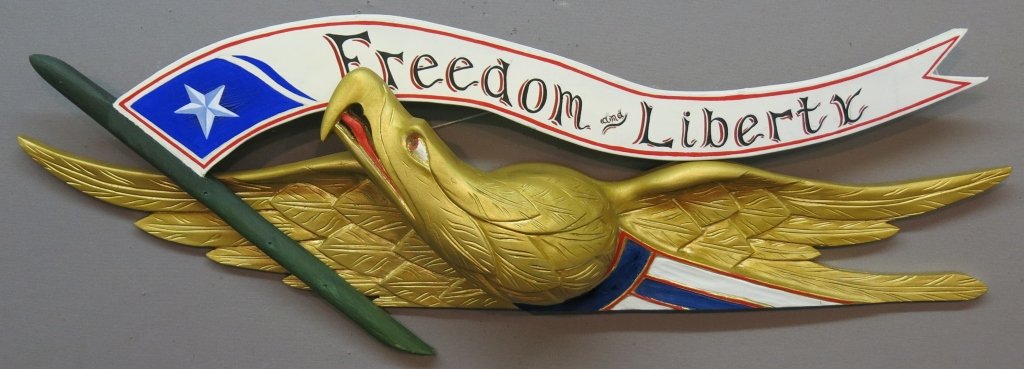 JEROME HOWES CARVED EAGLE AND BANNER PLAQUE: - 38" ACROSS