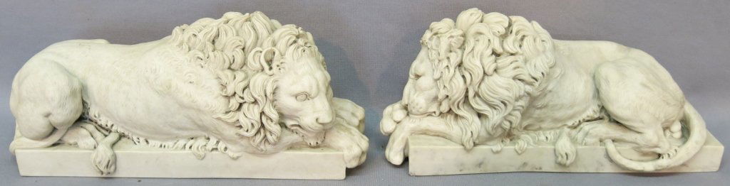 PAIR OF CAST MARBLE LION STATUES: WITH INSET "ARTS AND COMMERCE PROMOTED" BRONZE MEDALLIONS; 12 1/2" X 4" X 6"