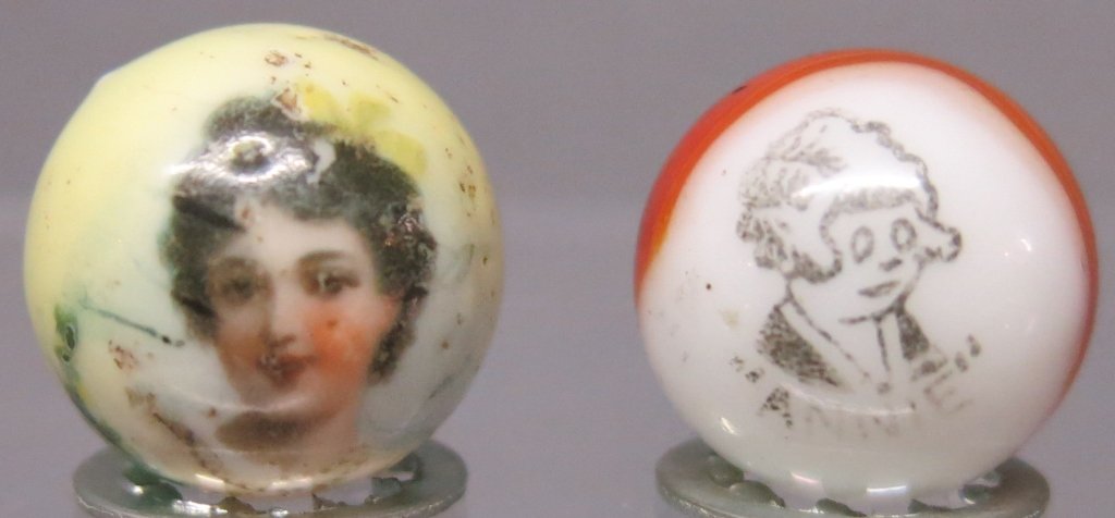 TWO MARBLES: PELTIER 'ANNIE COMIC' - 5/8" DIA., (1 of 2)