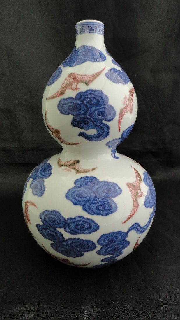 Fine Chinese Double Gourd Vase underglaze Red: A fine Chinese vase made in the shape of double gourd, decorated with bats flying (underglaze red) amongst cloud, signed Qianlong mark, but from early 1900's. This vase is 8.5 inches tall and 4.5 inch