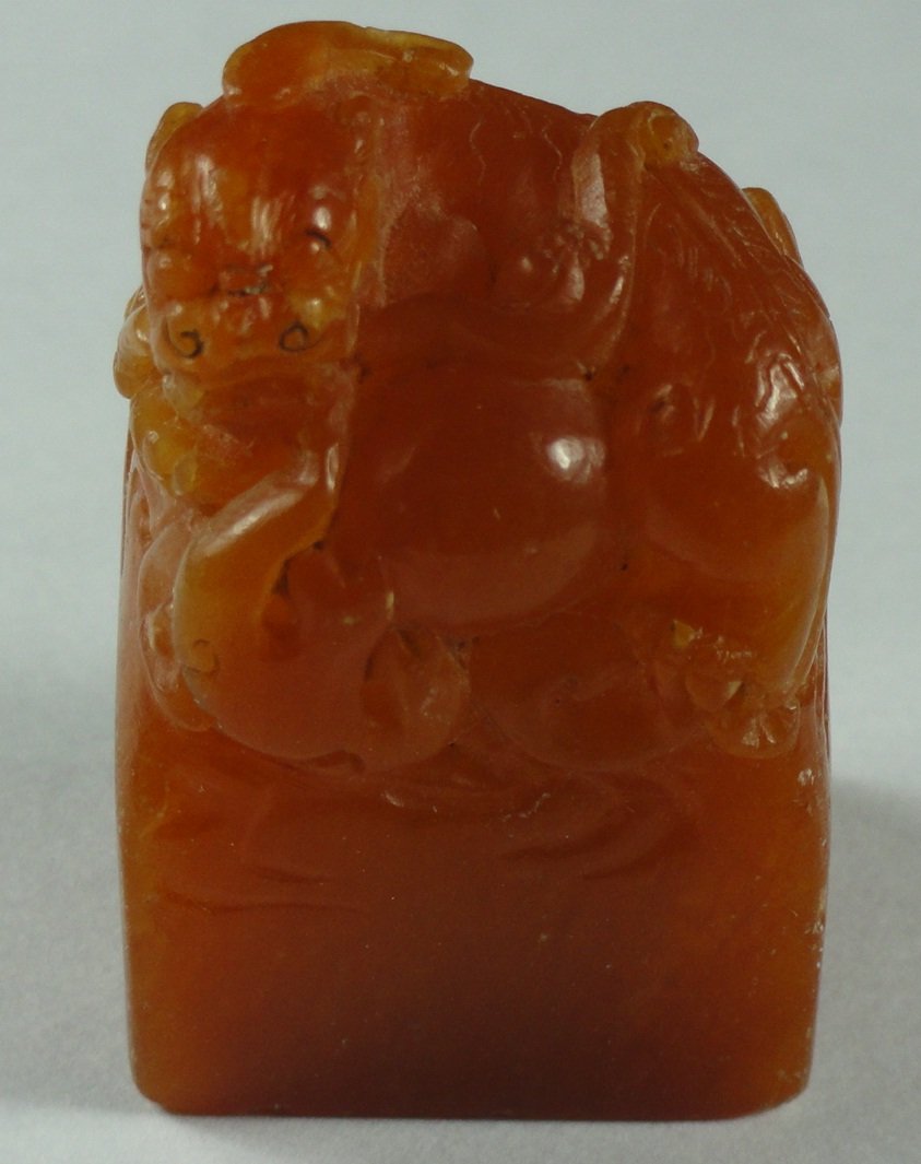 A Yellow Soapstone Scholar Seal.: This seal is 1.5 inches tall and 1 inch wide. There are scratches and tinny pin-sized dots on the surface, but nothing serious. No chips or cracks.