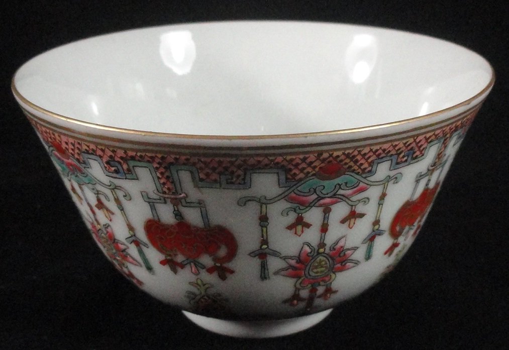 A Fine 19th Century Chinese Famille Rose Bowl: A fine Chinese Famille Rose bowl decorated with bats, lanterns and other emblems, signed in iron red at the underside, from the early 1900's. The bowl is 5 inch wide and 2.7 inch tall, in excellent co