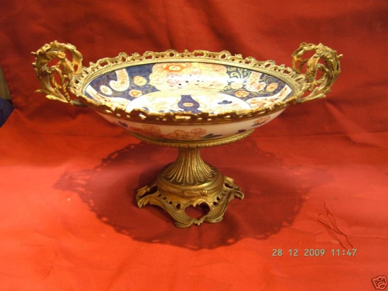 Large 19th Century Ormolu mounted Punch bowl: A perfect center piece, large Chinese export punch bowl decorated in the imari designs, from 19th Century, and mounted on a 19th Century French ormolu mount. This piece is in excellent condition and m