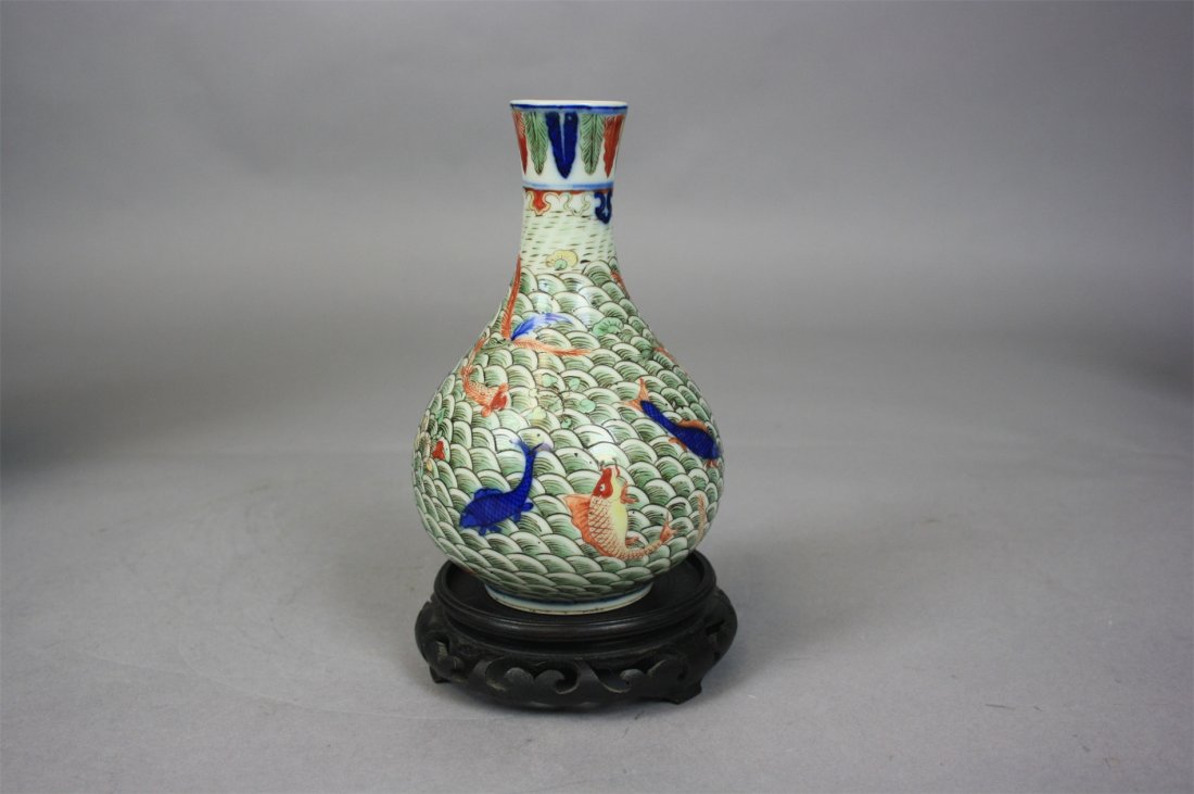 Chinese Blue and White WuCai Porcelain Vase 18th Cent: Chinese Blue and White WuCai Porcelain Vase 18th Century. Tall : 17cm. Good condition. Chinese wucai enameled porcelain vase, of bulbous form: with design of fishes amid green waves and seaweed; with
