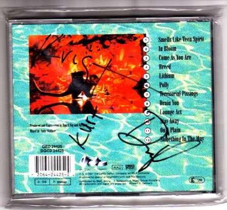 Nirvana including Kurt Cobain Signed Nevermind CD: This item is an original Nevermind CD signed by Kurt Cobain, Krist Novoselic and David Grohl of all time grunge legends Nirvana. The item, which was signed at Le Zenith, Paris, on 24/06/1992, is a per