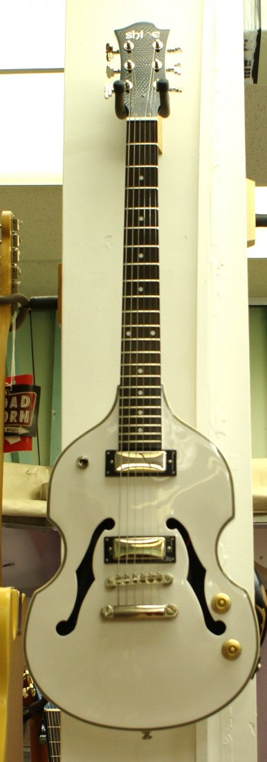 Shine Violin Guitar. Only 1 in World. Factory Cust: This guitar is used, but in fantastic condition. Through this auction we are able to offer a number of fantastic vintage and contempoary guitars, at the best prices that you will ever find. This lot i