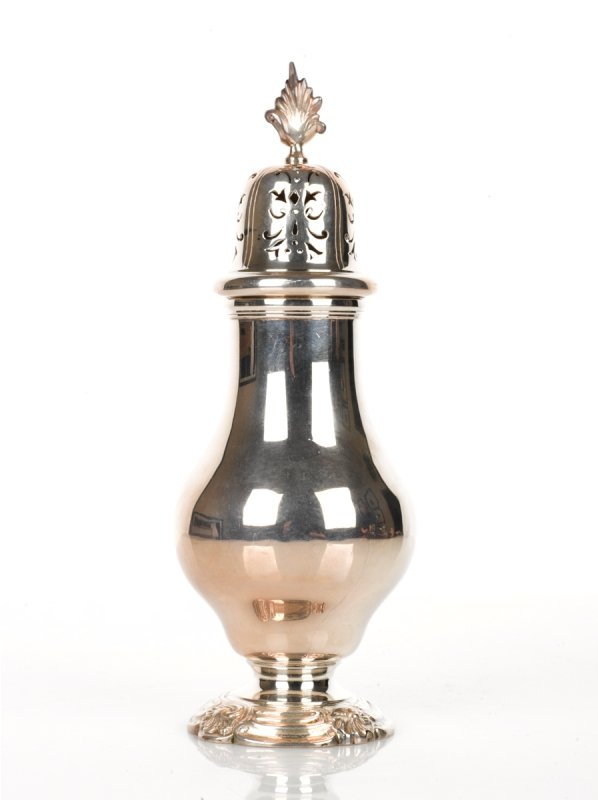 George V Silver Sugar Caster: with plain baluster body on a shaped circular moulded foliate foot, pull off cover pierced with scrolls and surmounted by a flame finial, Mappin and Webb, London 1927 height 20 cm weight 230 grams