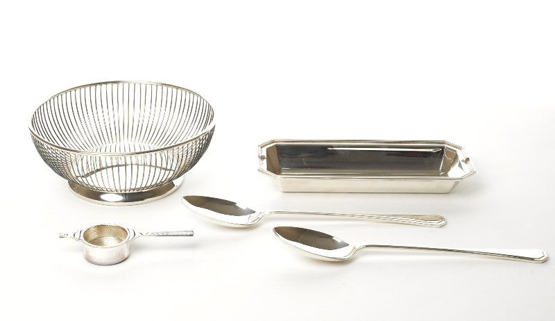 Collection of Table Accessories: comprising a fruit bowl marked Gorham, together with a tea strainer in original box marked 'Whitehill Property of 'Warris Sheffield', two carving spoons and a rectangular dish (5) The B