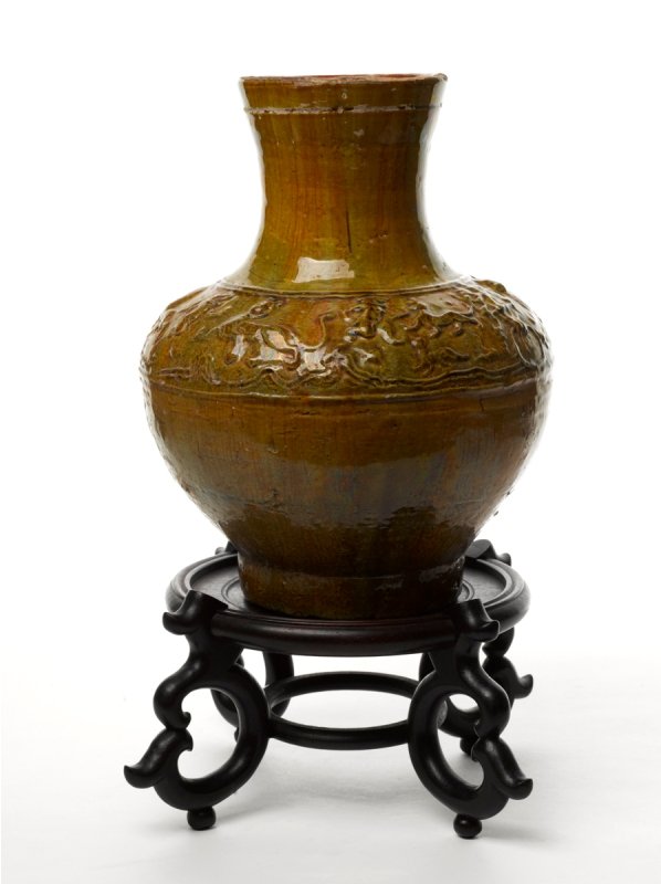 Chinese Han Type Pottery 'Hu' Shape Vase: moulded figural border and taotie mask handles, yellow green colour lead glaze with age iridescence, possibly Han Dynasty The Barbara Sheridan Donnay and the Late Gilbert J. Donnay Collection height 3