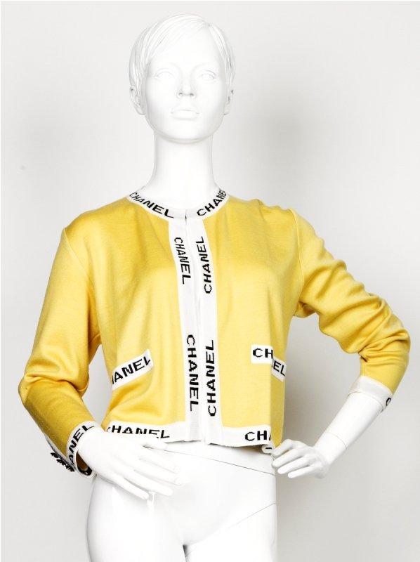Chanel Lemon Wool Jacket: Chanel Lemon Wool Jacket of collarless design, featuring a white border signed 'CHANEL' within the knit, decorative three 'CC' logo button cuff detailing, labelled Chanel Boutique