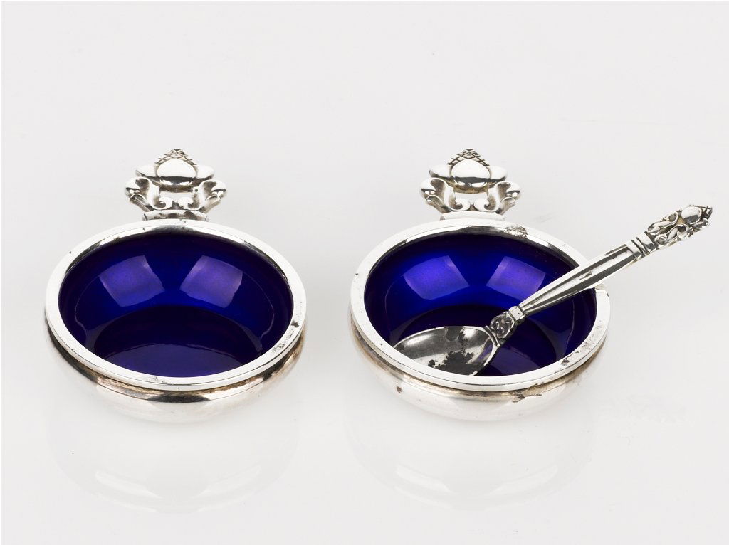 Johan Rohde, Pair of Acorn Pattern Salts: Johan Rohde, Pair of Acorn Pattern Salts blue glass liners with one spoon, all impressed 'Georg Jensen, Denmark' (2)