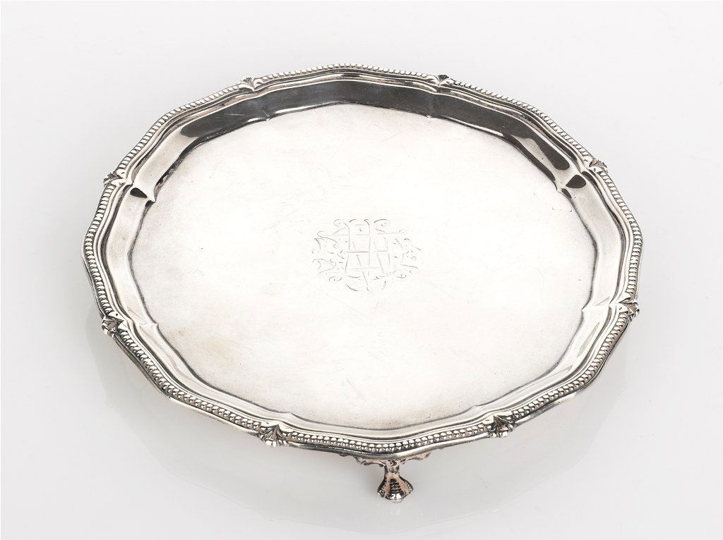 Travis Wilson Company Ltd, Sterling Silver Salver: Travis Wilson Company Ltd, Sterling Silver Salver wavy outline and gadrooned rim set on three ball and claw feet, engraved initials, Sheffield 1913 diameter 20.5 cm weight 363 grams