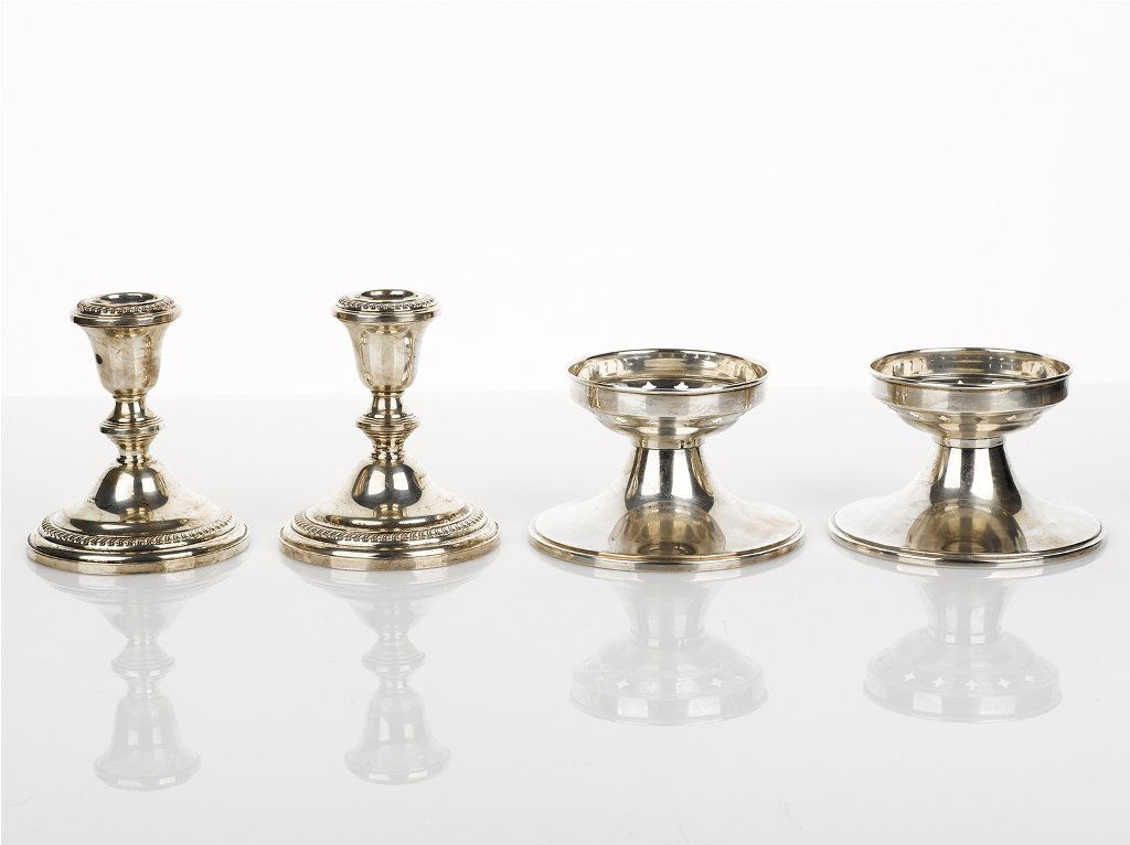 Wallis, Two Pairs of Sterling Silver Candle Stands: Wallis, Two Pairs of Sterling Silver Candle Stands one pair having pierced decoration, the other classical Empire style(4) (loaded) total weight 658 grams