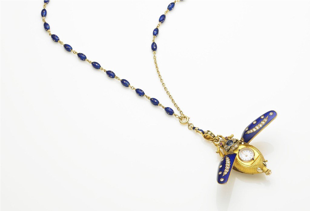 Attributed to Eugene Fontenay, Enamel Beetle Pendan: fine yellow gold, enamel,diamond, ruby and sapphire set, made for the Chinese market, blue enamel diamond set wings concealing white enamel dial, jewelled cylinder movement, finely carved body, ruby s