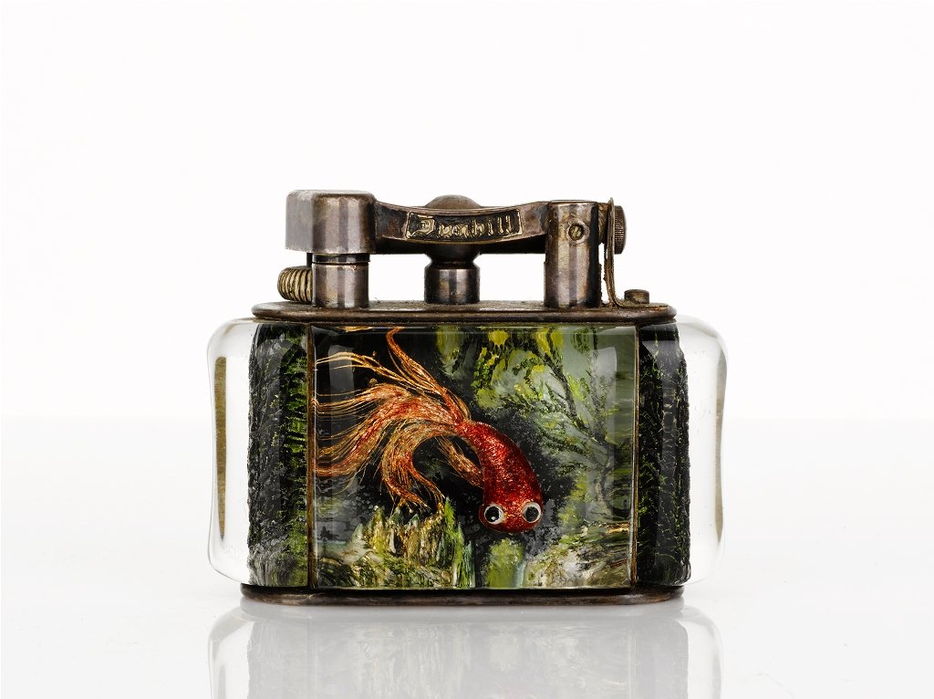 Dunhill, 'Aquarium' Table Lighter: mid-twentieth century, lucite panels decorated with fish and marine scapes, signed 'Dunhill' height 7.5 cm