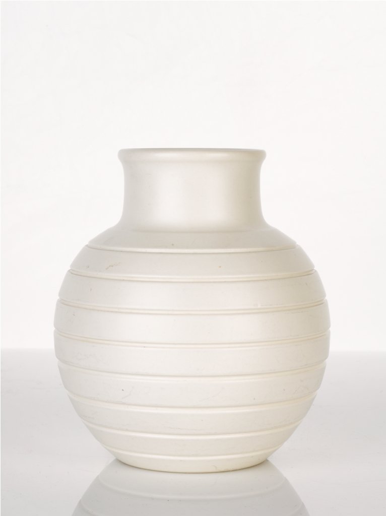 Keith Murray, Vase, c. 1940-1951: shape number 3801, moonstone white glaze, printed and impressed mark 'KM, Wedgwood of Etruria and Barlaston' height 15 cm