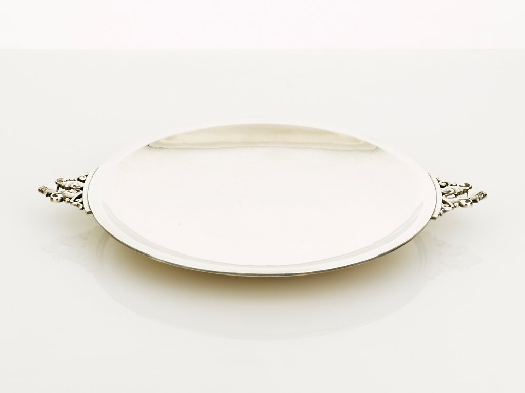 Johan Rohde, Sterling Silver Two Handled Dish: Johan Rohde, Sterling Silver Two Handled Dish shallow round dish, the handles in acorn pattern, impressed marks, pattern no. 657, manufactured for Georg Jensen, pre 1939 diameter 23.5 cm