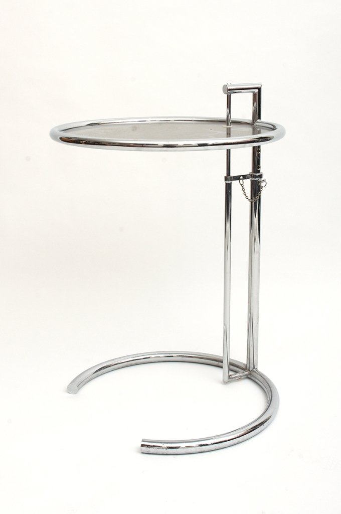 After Eileen Gray, Pair of Adjustable E 1027 Tables: Eileen Gray, Pair of Adjustable E 1027 Tables chrome frame with circular glass top (2) height 66-84cm Royal Bank of Scotland, Sydney PLEASE NOTE G.S.T. applies to the hammer price of this lot