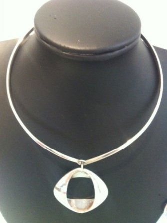 Henning Koppel Pendant Necklace no. 368: together with a pair of matching earrings no. 190, manufactured by Georg Jensen