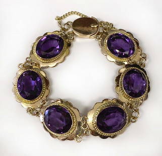 14KT YELLOW GOLD & AMETHYST COLORED STONE BRACELET W/ 6: 14KT YELLOW GOLD & AMETHYST COLORED STONE BRACELET W/ 6 MEDALLIONS APPROX. 6 1/2" LONG