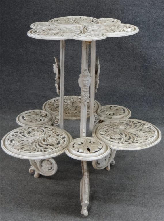 For Auction 2 TIER CAST IRON PLANT STAND W/ FACES 35" TALL X 30 (0397