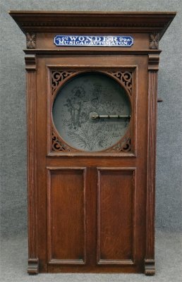 Wonder Musical Automaton Coin Operated Disc Player: Wonder Musical Automaton Coin Operated Disc Player & Discs, 23" X 14" X 44" Tall Lot 39: Wonder Musical Automaton Coin Operated Disc Player: There are 21 - 15 7/8” disks included with this lot. It i