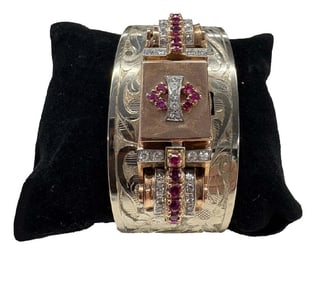 14KT GOLD BANGLE BRACELET W/ VINTAGE WATCH DIAMONDS & RUBIES 1/2" WATCH FACE 7 1/2" DIAM 46.9 DWT
