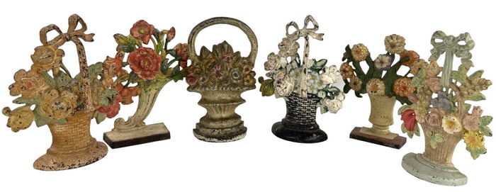 6 CAST IRON DOORSTOPS, ALL BASKETS OF FLOWERS ALL APPROX. 10 1/2" TALL