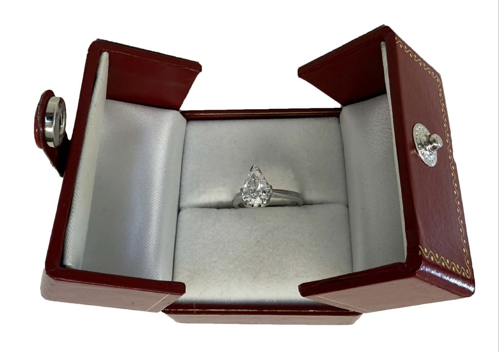1.2 CARAT PEAR SHAPED SOLITAIRE IN 14KT WHITE GOLD F-G COLOR SETTING RING SIZE APPROX. 4 1/2 1.8 DWT: 1.2 CARAT PEAR SHAPED SOLITAIRE IN 14KT WHITE GOLD F-G COLOR SETTING RING SIZE APPROX. 4 1/2 1.8 DWT