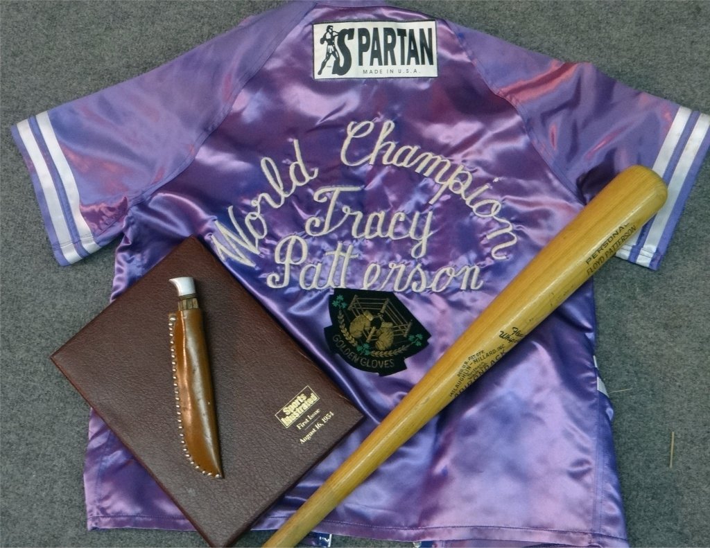 FLOYD PATTERSON MEMORABILIA: AUTOGRAPHED PERSONALIZED BAT, PRESENTATION BUCK KNIFE, TRACY RING JACKET, G.G. PATCH, 1ST ISSUE SPORTS ILLUSTRATED