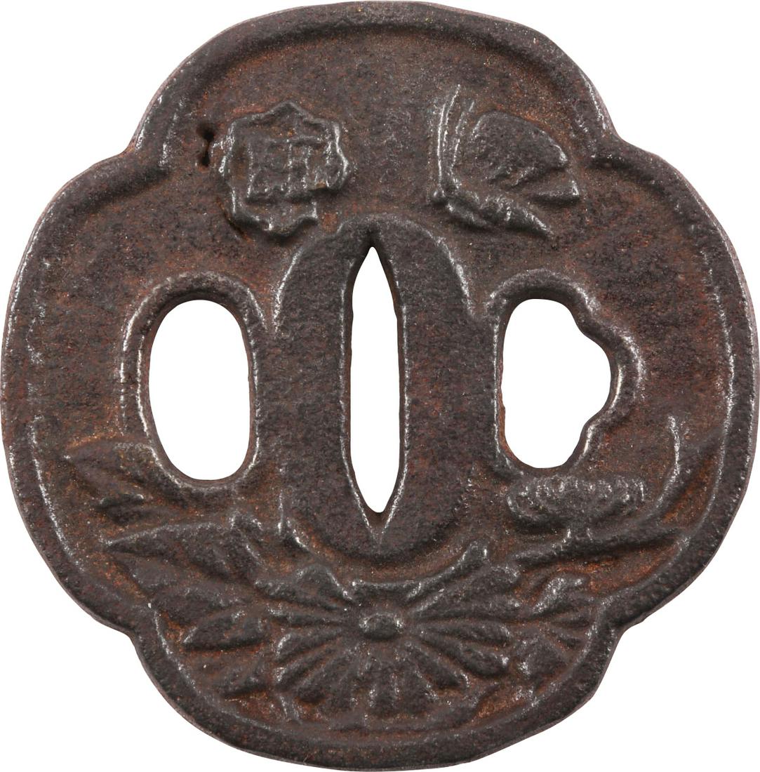 JAPANESE SWORD GUARD TSUBA: Iron, mokko form, 2 7/8" height. Two riobitsu. Front with foliage and bud decoration. The back plain. Surface textured.